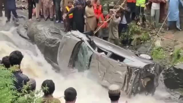 Car in flooded water.