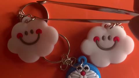 Key Pendant - robot cat chasing clouds