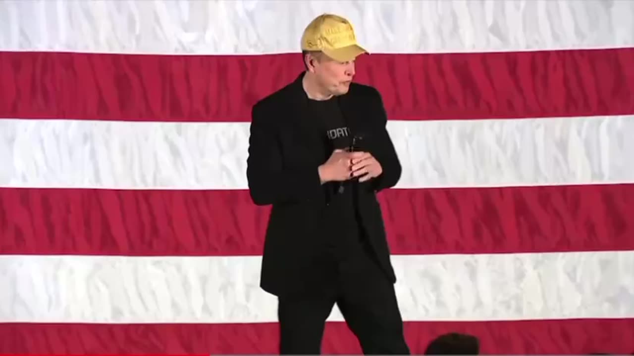 Someone gave Elon a Gold MAGA hat