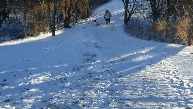 Olivia's sledding in snow