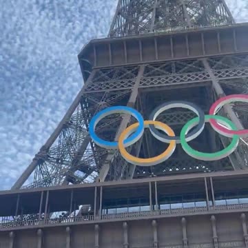 Someone is climbing up the Eiffel Tower right now!