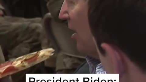 President Biden sits down for a slice of pizza with U.S. troops