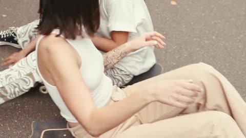 Women Sitting on Skateboards