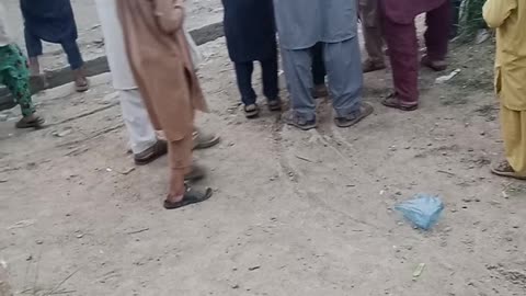 Boys blasting small bombs at the weeding of their friend
