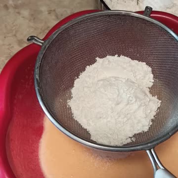 Gradually adding flour