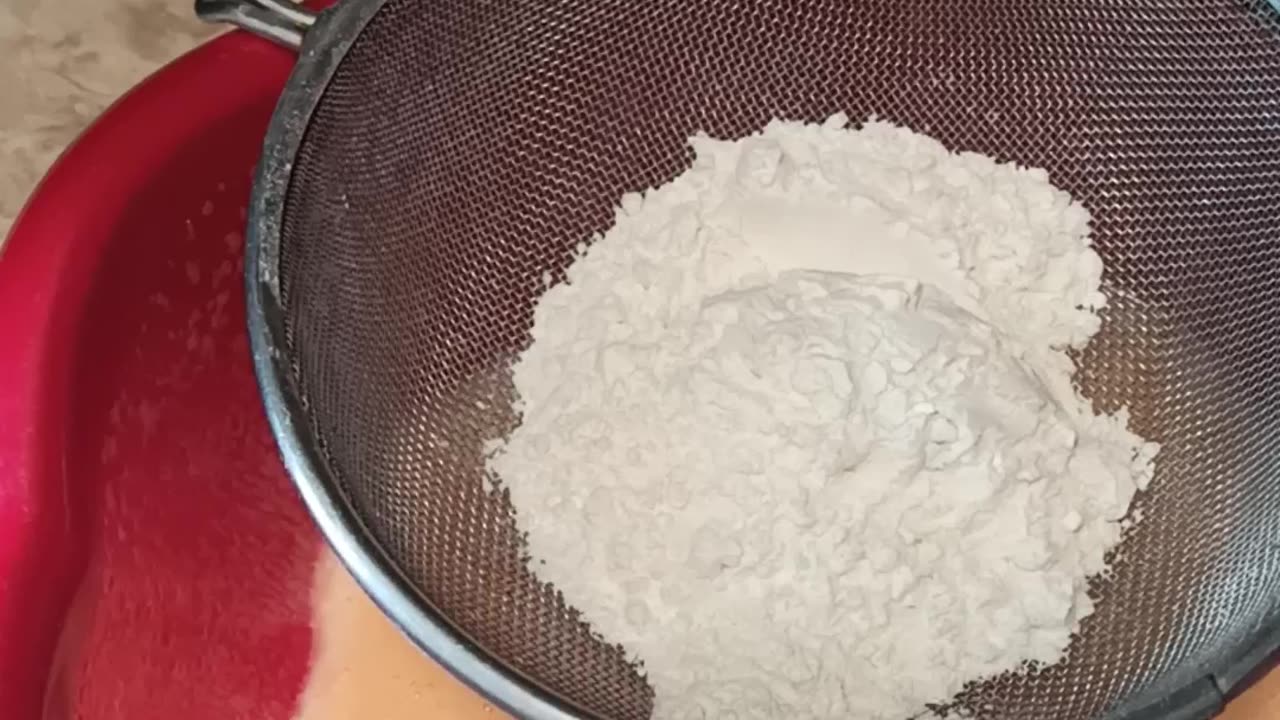 Gradually adding flour