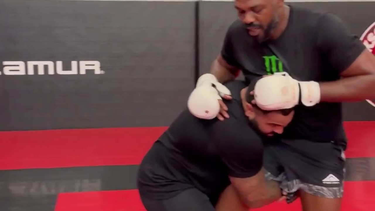 Jon Jones Almost KO's Gable Steveson With a Flying Knee in Training