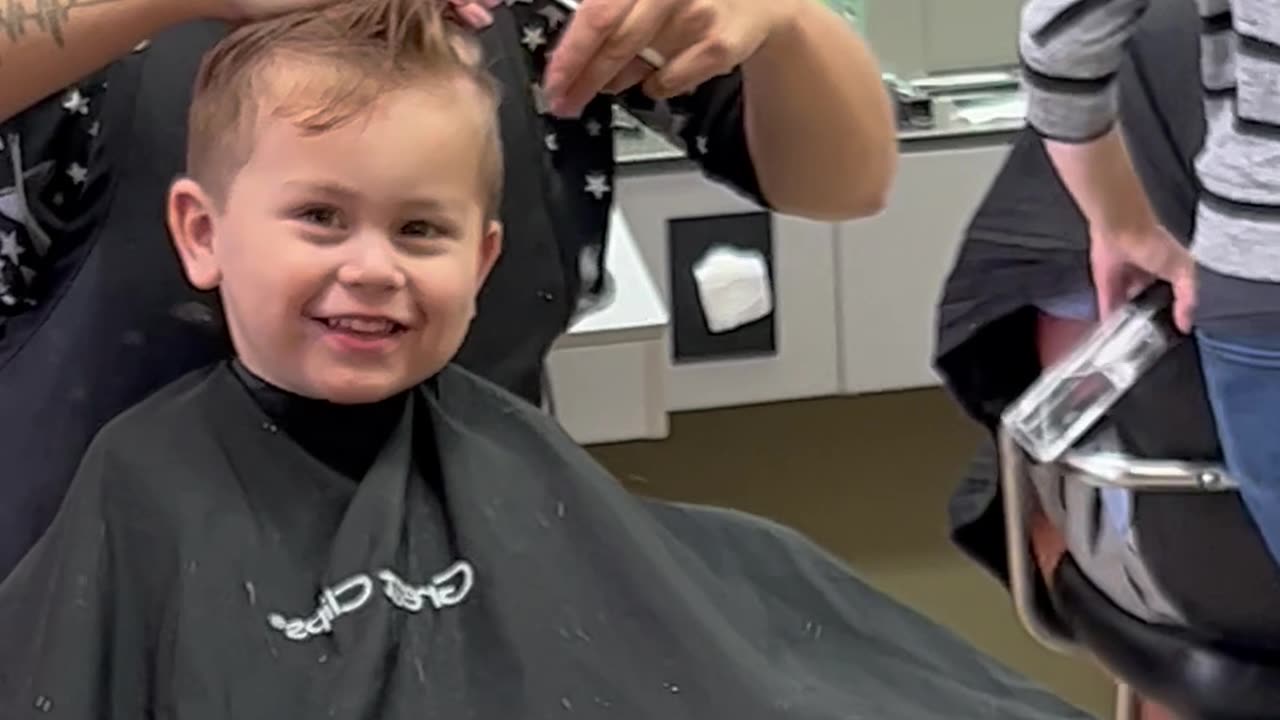 Son Practices His Best Blue Steel During Haircut