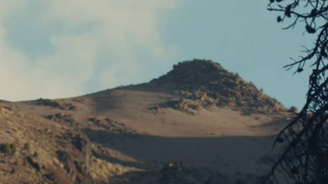 Timelapse of the sky behind a mountain