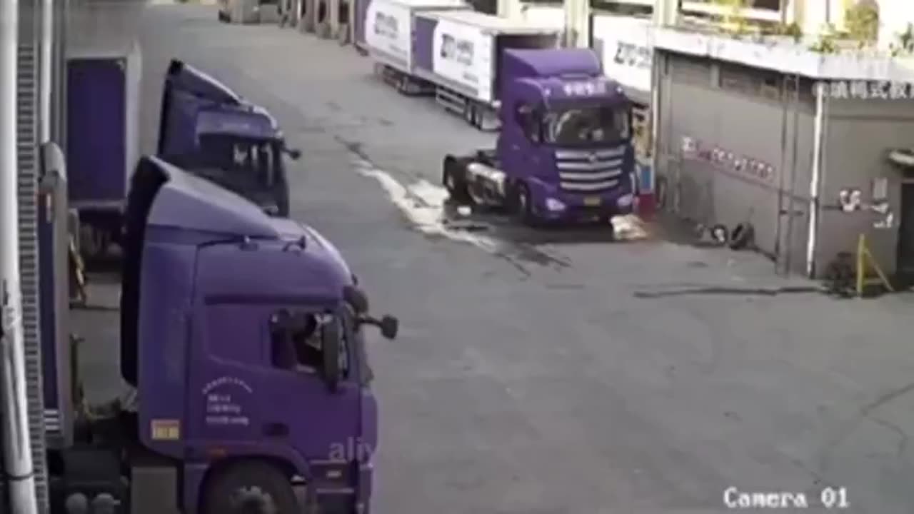 Man thinks he is strong enough to stop a rolling semi truck.