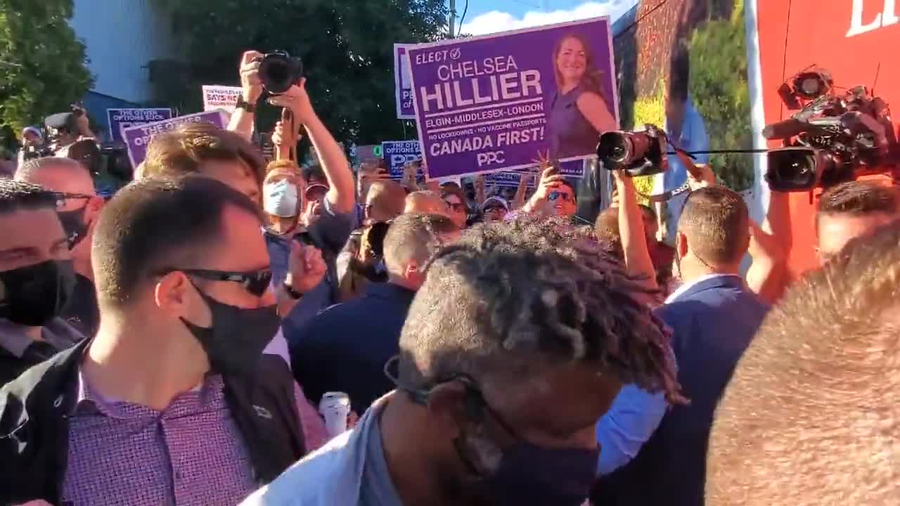 An angry crowd shouts obscenities at Trudeau and someone throws gravel at him in London, Ontario.