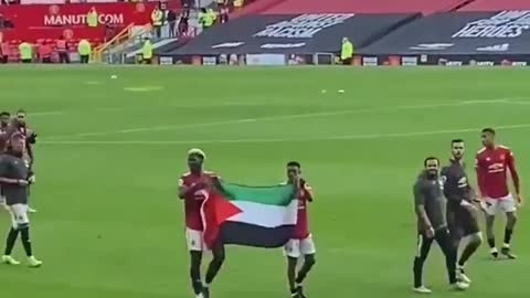 Paul Pogba and Amad DIallo Wave Palestinian flag after Fulham Game