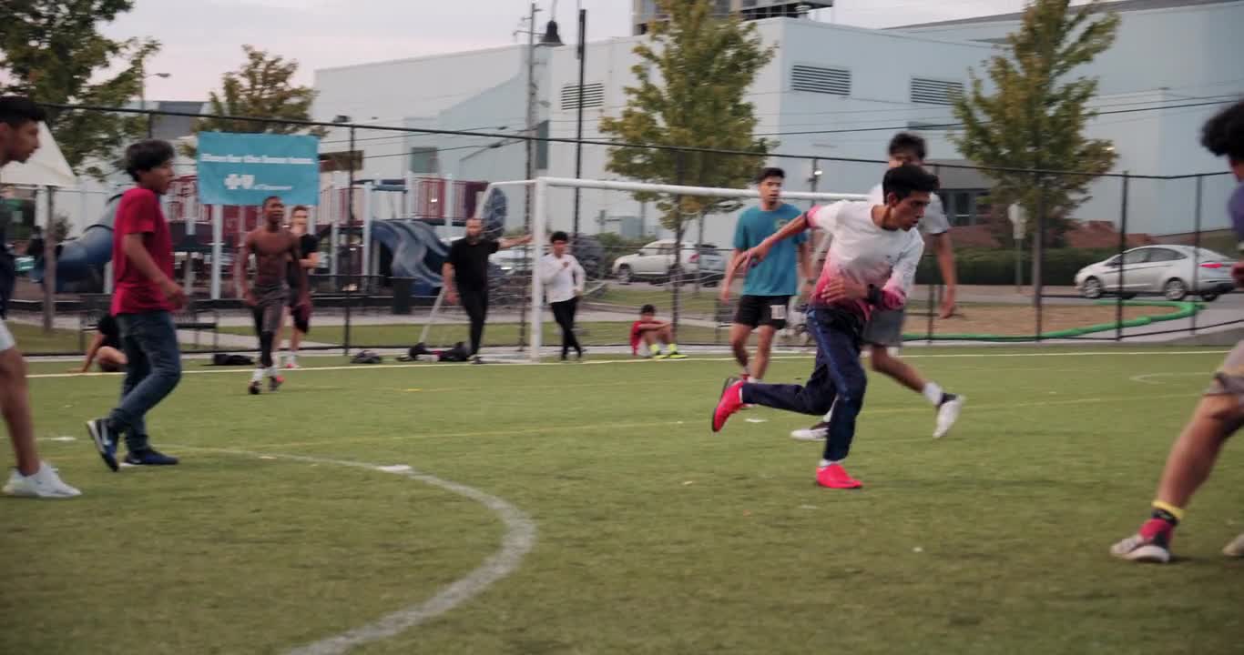 Group Of Boys Plays Soccer In A Soccer Field