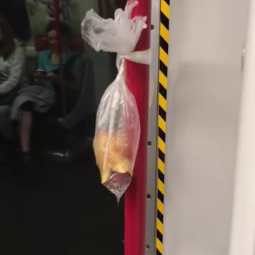 A bag with bitten apples on subway