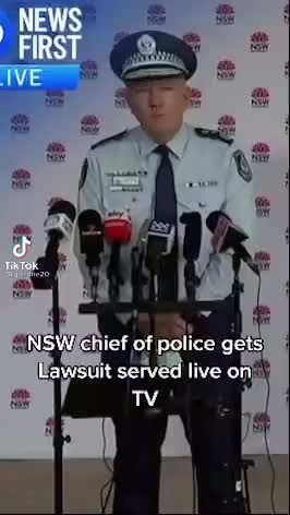 NSW police chief gets served lawsuit live on-air.