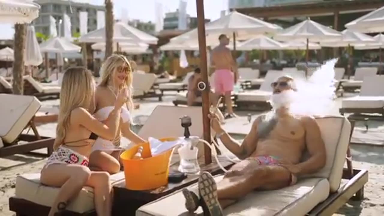 Tate smoking shisha at Romanian beach with girls
