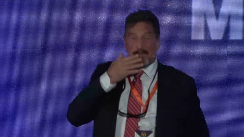 John McAfee Gives Speech At The Barcelona Blockchain Week 2019