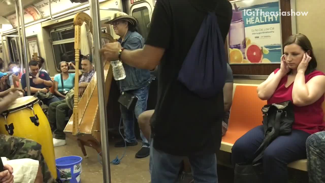 Drums harp and a man singing train