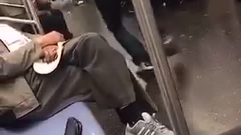 Guy grey hoodie dancing on subway