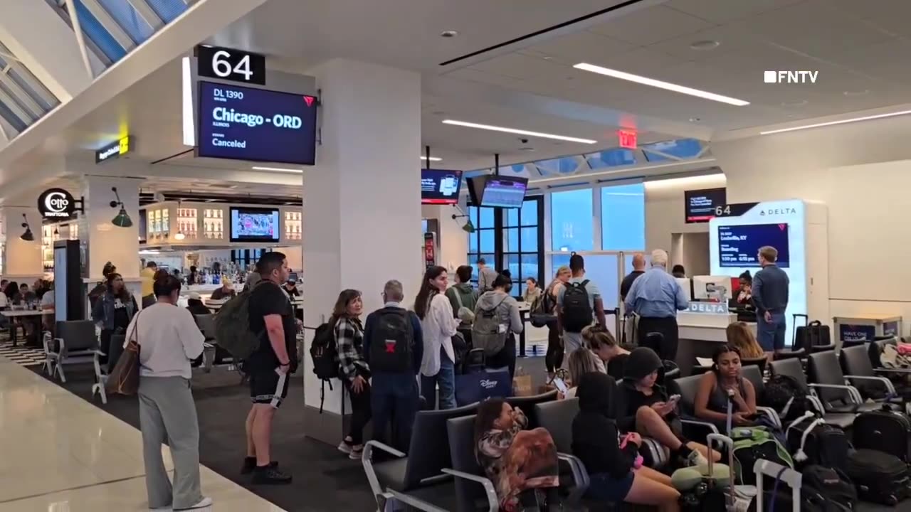 Huge lines at LGA Airport as travelers hope to rebook their flights after MASS Cancelations.