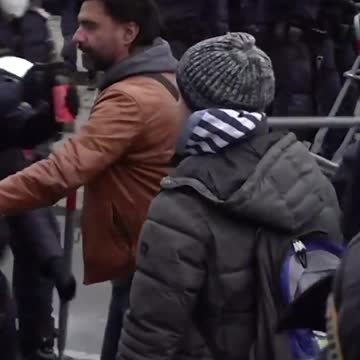 Protesters broke down police barriers in Vienna