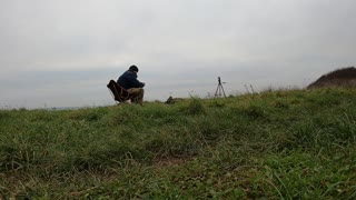 Vlog on top of cliff overlooking the sea. Speedlapse