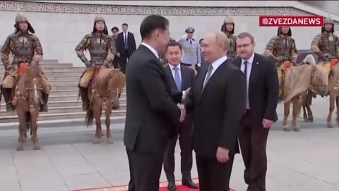 Putin is received by the Mongolian President with an honor guard of cavalry and ceremonial guards