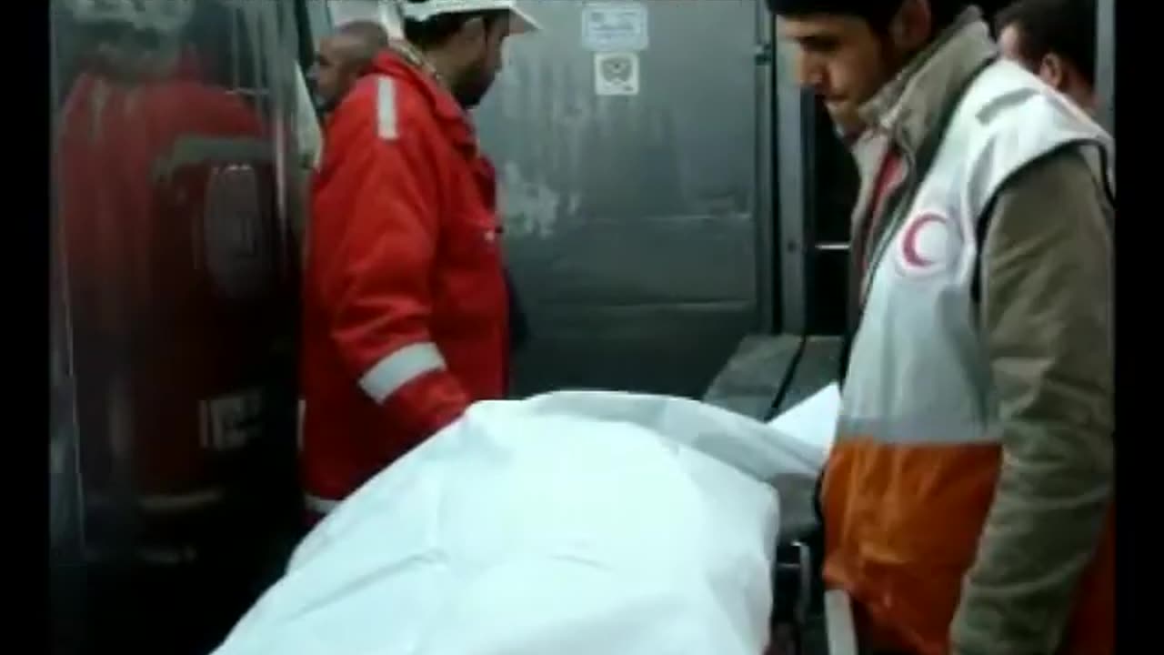 Recovering the body parts of a Palestinian woman killed by Israeli drone strike (2009)