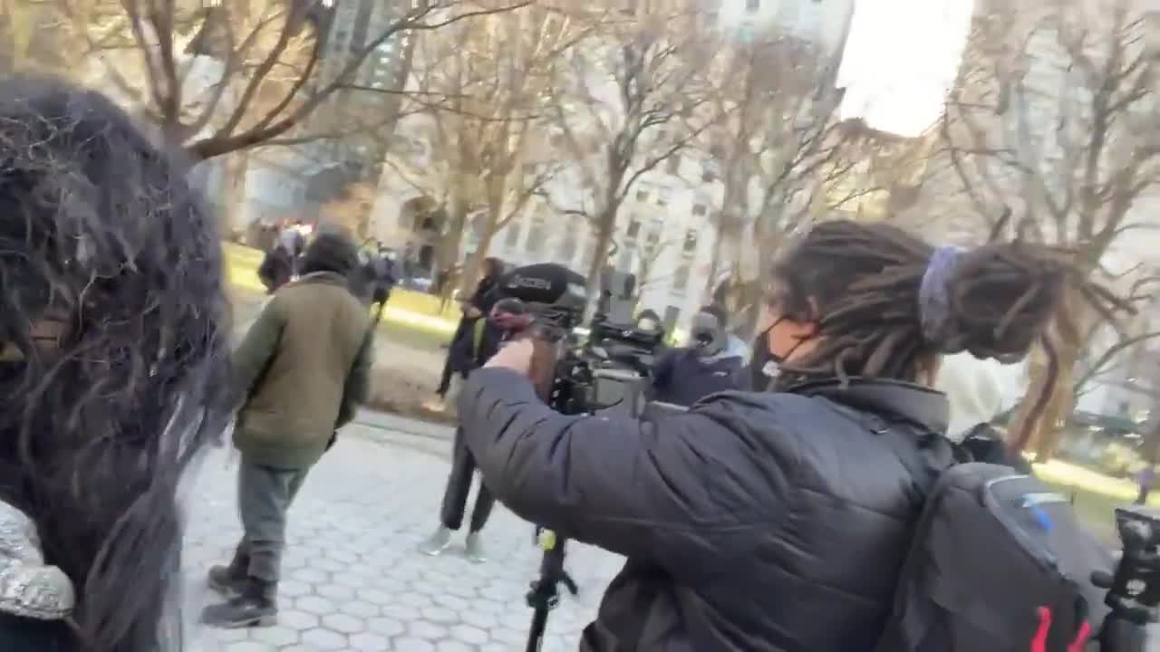 Woman attacked, hit with umbrella, spat on, as the crowd says don’t protect her she’s for Trump.