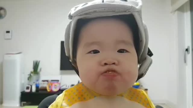 Baby eating tangerine