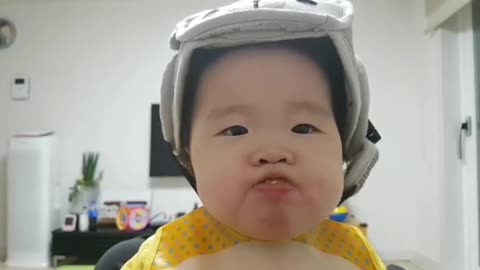 Baby eating tangerine