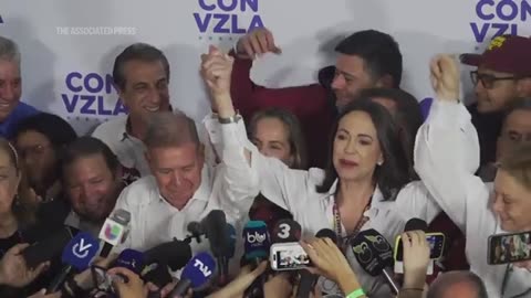 Supporters of Maduro and opposition shout at each other on Venezuela's election day