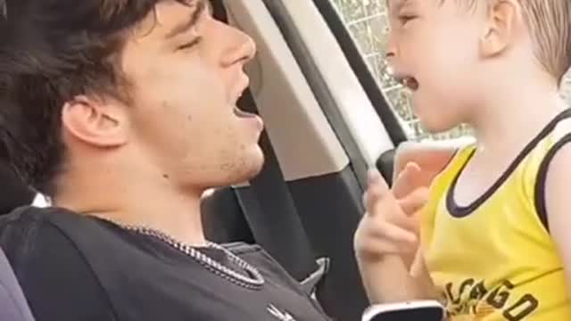 CUTE,Father and son singing together