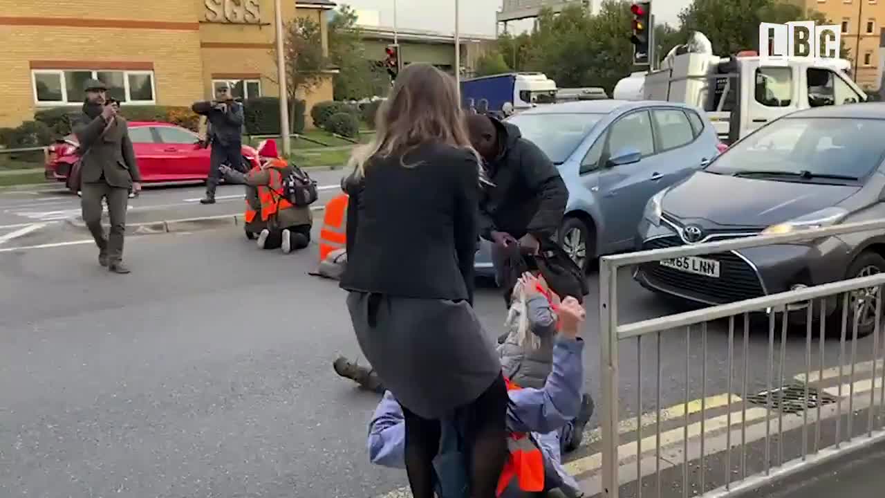 Enraged drivers starting to drag eco-mob activists off the road because they have to go to work