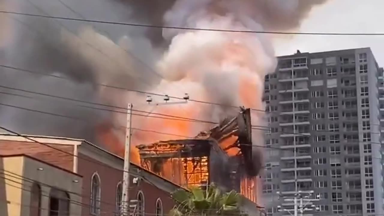 TOWER OF HISTORIC CHILEAN CHURCH TUMBLES INTO FLAMES