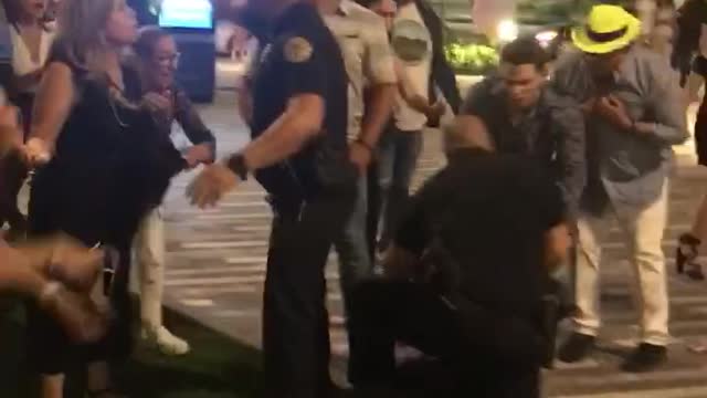 Woman Uses Her Heel to Hit Cop