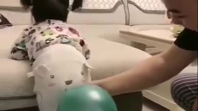 Funny baby...The new way to baloon blowing