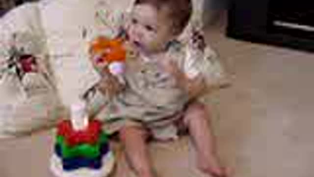 Emma Kai Swier playing with toys