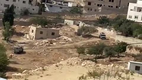 Palestinian media report that Israeli troops are surrounding a building in the