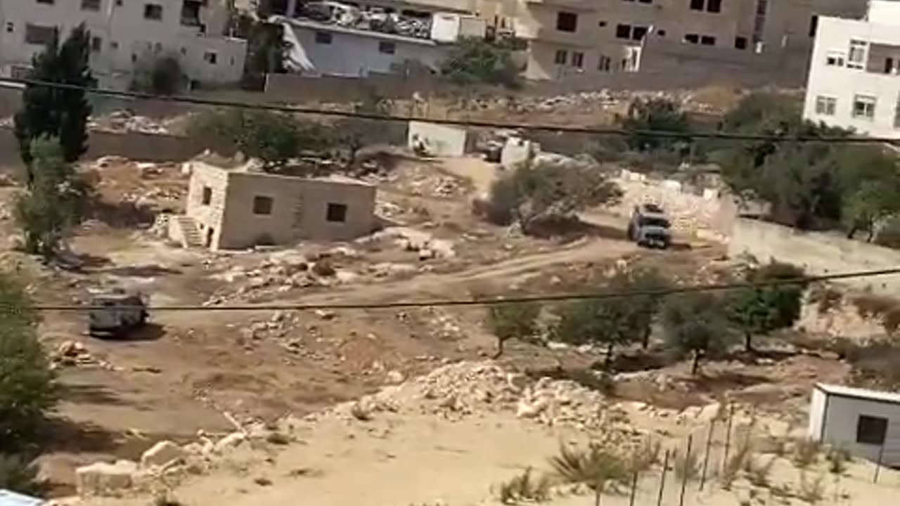 Palestinian media report that Israeli troops are surrounding a building in the