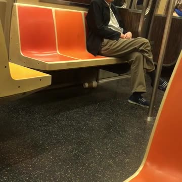 Old man in black jacket moving his shoulders