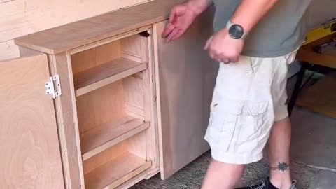 Man is showcasing his custom cabinet that turns into a table to save space 😲