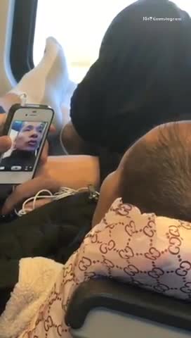 Guy facetiming woman while laying down on train