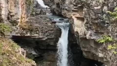 Double backflip into hidden waterfall