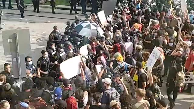 Protesters turne violent in downtown houston destroying a police car