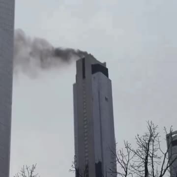 Smoke spotted bursting out of an under-construction skyscraper near One World Trade Center