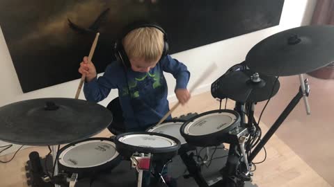 A Boy playing the drums