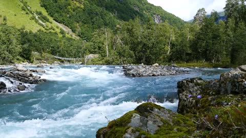 wild clear blue stream in morkidsdalen park skjolden norway