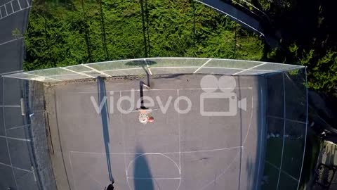 player shooting a jump shot on an outdoor court 1