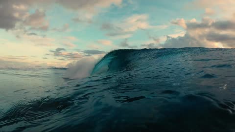 Ocean waves at sunset.